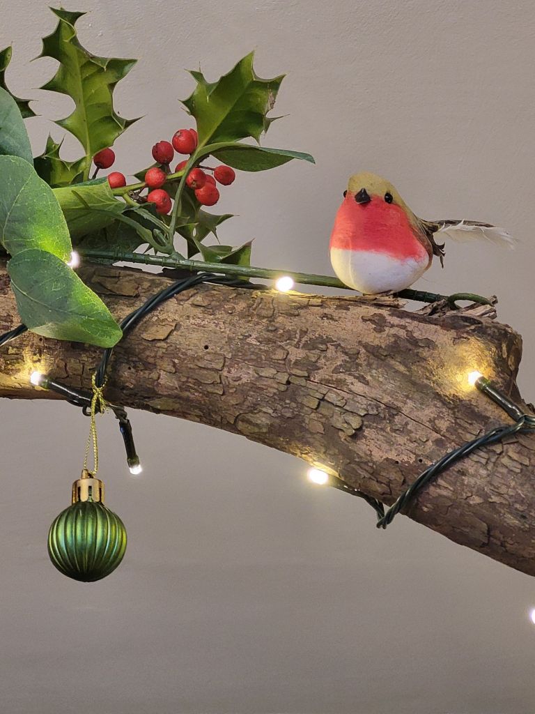 A fallen log can be used as a dramatic decoration at Christmas.
